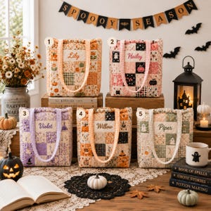 May include: Five quilted tote bags with patchwork patterns in orange, pink, purple, and neutral tones. Each bag features a rectangular label with the embroidered names Lily, Hailey, Violet, Willow, and Piper. The bags have gingham handles.