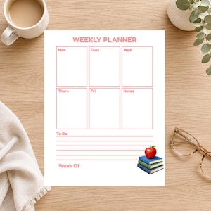 May include: A white weekly planner sheet with pink text and borders. It features sections for Mon, Tues, Wed, Thurs, Fri, and Notes, plus a To Do list area. A small illustration of three stacked books topped with a red apple sits at the bottom.