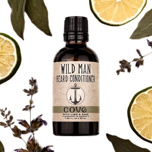 Wild Man Beard Oil Conditioner Cove scent in 50ml amber glass bottle. Lime slices and sage leaves surround.