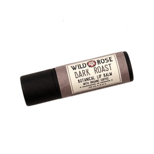 Dark Roast Lip Balm in a biodegradable paper tube on a white background.