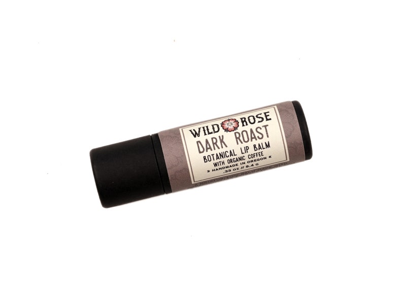 Dark Roast Lip Balm in a biodegradable paper tube on a white background.