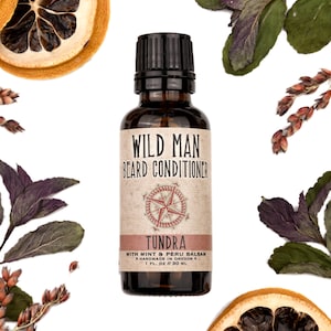 Wild Man Beard Oil Conditioner Tundra scent in 30ml amber glass bottle. Lemon slices and peppermint leaves surround.