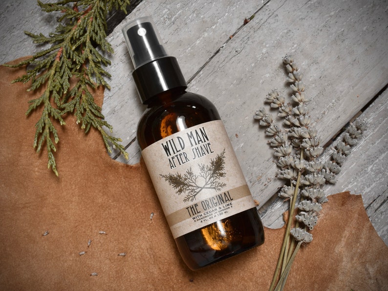 WIld Man After Shave 4oz amber glass bottle in The Original scent. Dried botanicals surround.