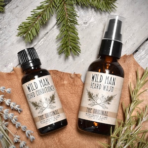 Wild Man beard Care Gift Set with Beard Oil Conditioner and Beard Wash in The Original scent. Dried botanicals surround.