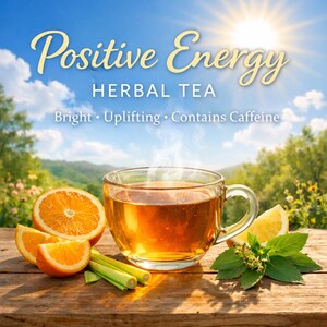 May include: A clear glass teacup filled with herbal tea, with steam rising. The image includes orange slices, lemon, and lemongrass on a wooden table. Text reads "Positive Energy Herbal Tea".