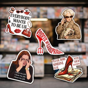 May include: A collection of stickers featuring quotes and imagery from the movie "The Devil Wears Prada." Stickers include a red stiletto, text that reads "Everybody Wants to Be Us," and a woman on the phone.