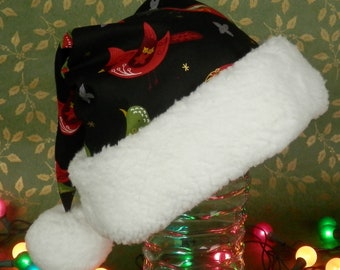 Red Cardinal Santa Hat, Black with Christmas Red and Green Birds Decorated in Folk Art Style with Metallic Gold, White Faux Sherpa Fur Trim