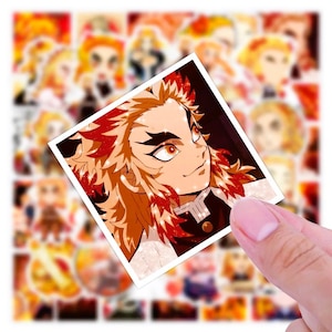 May include: A square sticker featuring a character with orange and red hair, black eyebrows, and orange eyes. The sticker is held in a hand, with a background of similar stickers. The character is from the anime series Demon Slayer.
