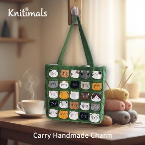 May include: A green crocheted tote bag with a grid pattern of cat faces in various colors. The bag has green handles and the text "Knitimals" and "Carry Handmade Charm". The bag is hanging on a wooden hook.