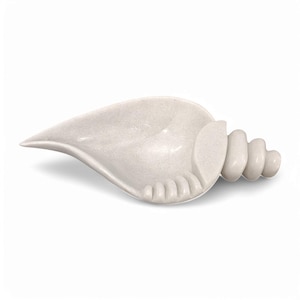 May include: A white marble seashell dish with a spiral design. The dish is perfect for holding small items like jewelry or keys.