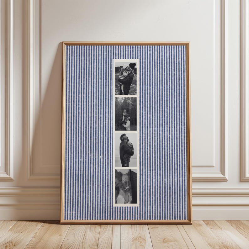 May include: A framed piece of art featuring four black and white photographs. The background is a blue and white striped fabric. The frame is a light brown color.