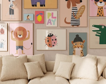 May include: A collection of framed art prints featuring whimsical animal illustrations. The artwork includes a dog with a beret, a purple elephant, a lion, a ladybug, and a cheetah. The prints are displayed above a beige sofa with several matching pillows.