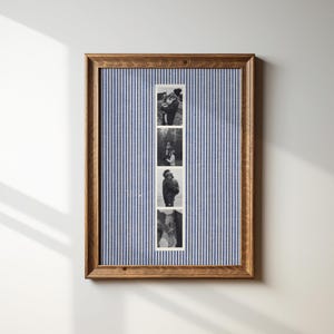 May include: A framed photo display featuring four black and white images. The frame is made of wood and surrounds a blue and white striped fabric background. The photos appear to be of a couple.