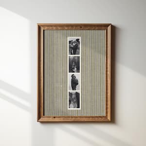 May include: A framed photo display featuring four black and white images. The frame is made of wood with a dark finish. The background is a green and white striped fabric. The photos appear to be of a couple.