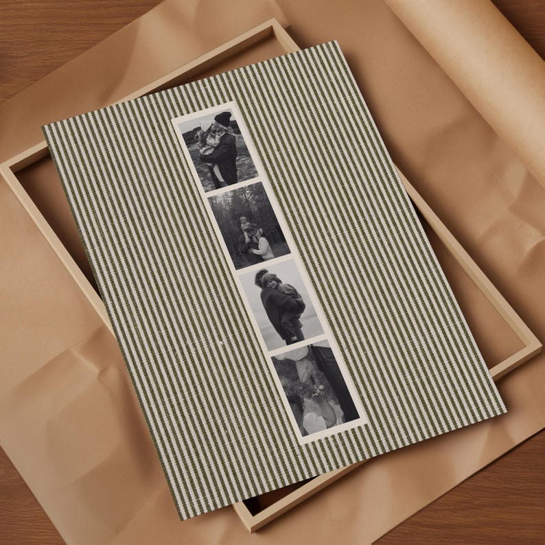 May include: A framed photo display featuring a green and white striped fabric background. The display holds four black and white photographs. The frame is made of light-colored wood, and the background is brown paper.