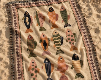 Folkloristische geweven deken met vissenmotief, jacquard plaid met kustthema, nautische textielkunst, Scandinavische deken met vissenmotief, cottagecore woondecoratie