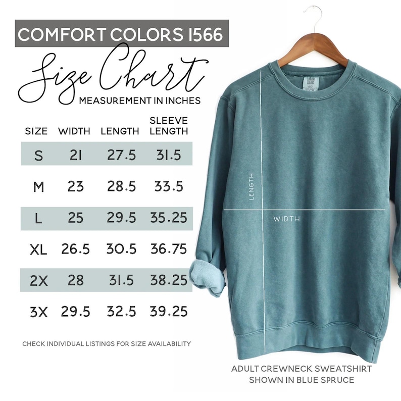 May include: A blue spruce adult crewneck sweatshirt displayed on a wooden hanger. The image includes a size chart with measurements in inches for width, length, and sleeve length. The chart lists sizes S through 3X.