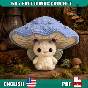 May include: A crochet plush toy featuring a cream-colored body with a large, wide, light blue mushroom cap adorned with small raised dots. The figure has two small antennae with purple tips, black eyes, a stitched smile, and two small green wings.