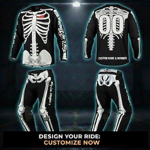 May include: A black and white skeleton-themed motocross jersey and trousers set. The jersey features a rib cage design on the front and back, with customisable name and number options. The trousers have a matching bone design.