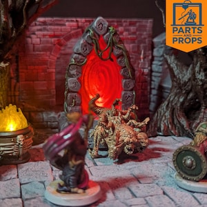 May include: A miniature fantasy scene with a glowing red portal framed by stone. A detailed monster figure stands before the portal, with a miniature figure in the foreground. The scene is set on a stone surface, with a logo in the upper right corner.