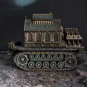 May include: A miniature model of a building mounted on a tracked vehicle base. The structure features a dark, weathered roof, arched windows with grilles, and a mechanical engine section at the rear. The entire piece has a metallic finish.