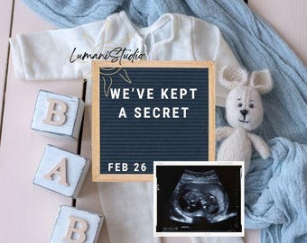 May include: A pregnancy announcement featuring a white onesie, wooden letter blocks spelling "BAB", and a knitted bunny. A framed message board reads "WE'VE KEPT A SECRET" and "FEB 26". An ultrasound image is also included.