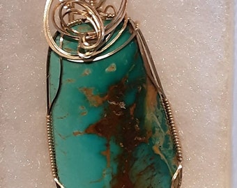 Kingman Ceremonial Turquoise pendant wrapped in 14kt gold filled wire.