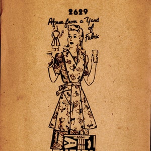 May include: A vintage sewing pattern for an apron, labeled "Apron from a Yard of Fabric" and numbered "2629". The pattern shows a woman wearing a floral print apron with a sash and a bib.