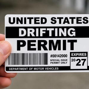 May include: A rectangular white card with black text reading UNITED STATES DRIFTING PERMIT. It includes a barcode, the number #00142000, the text SPECIAL ISSUE PERMIT ONLY, DEPARTMENT OF MOTOR VEHICLES, and an expiration date of 2027.