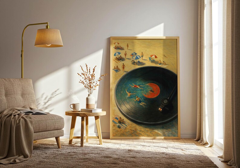 May include: A framed art print depicts a vinyl record with people swimming in the grooves, set against a beach scene. The artwork is in a room with a beige armchair, a gold lamp, and a small wooden side table. The room has a neutral color palette.