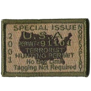 May include: A rectangular olive green and tan embroidered patch featuring a map of the USA. Text reads: SPECIAL ISSUE, U.S.A., PERMIT: 91101, TERRORIST HUNTING PERMIT, No Bag Limit, Tagging Not Required, 2001, and NONEXPIRY.