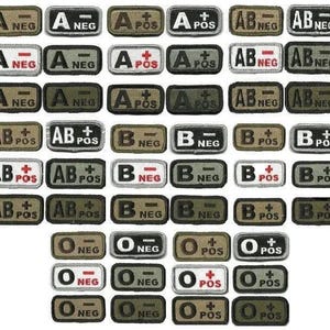 May include: Blood type patches in various styles. The patches display blood types such as A, B, AB, and O, with positive and negative indicators. The patches are rectangular with a black border and text in white or red.