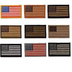 May include: Nine embroidered patches in the shape of the American flag. The patches feature various color schemes, including red, white, and blue, as well as subdued earth tones and black and white variations. The patches are rectangular with a stitched border.