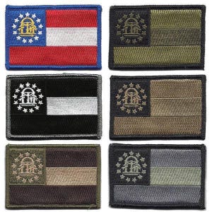 May include: A collection of six embroidered patches featuring the flag of Georgia. The patches display the state flag in various color schemes, including the traditional red, white, and blue, as well as black, gray, and olive green variations. Each patch has a rectangular shape.