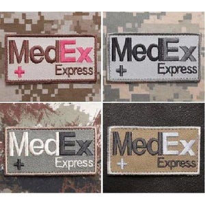 May include: Four rectangular patches with the text "MedEx Express" in various color combinations. The patches feature the text in brown, black, gray, and white, with a plus sign symbol. The background is camouflage.
