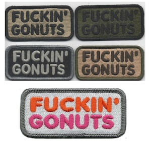 May include: Embroidered patches with the text "FUCKIN' GONUTS" in various color combinations. Patches include olive green, brown, gray, and a white patch with orange and pink lettering. The patches have a rectangular shape.