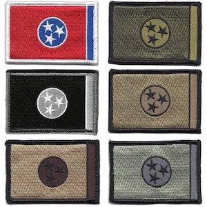 May include: A collection of six rectangular patches featuring the Tennessee state flag design. The patches vary in color, including red, black, olive green, and tan, with a white or silver border. Each patch has a circle with three white or dark stars.
