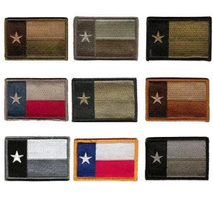 May include: Nine embroidered patches featuring the Texas state flag design. Each patch has a rectangular shape with a star on the left and a two-tone background. The color schemes vary, including combinations of green, brown, black, white, red, and blue.