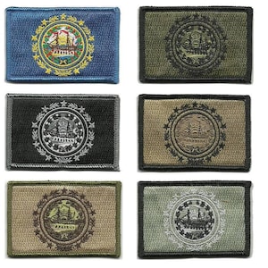 May include: Six rectangular embroidered patches featuring the New Hampshire state seal. The patches are in various colors, including blue, green, black, and tan. Each patch has a detailed circular emblem with a ship and surrounding text.