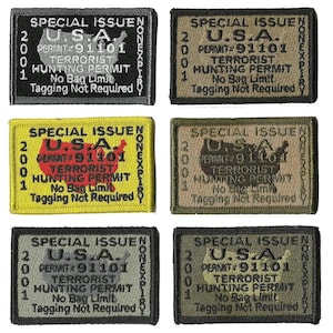 May include: Six embroidered patches with the text "SPECIAL ISSUE U.S.A. TERRORIST HUNTING PERMIT" and "NONEXPIRY". Each patch features the text "2001" and "PERMIT #91101". The patches are in various colors, including black, olive green, and yellow.