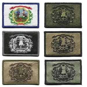 May include: A collection of embroidered patches featuring the West Virginia state flag and seal. The patches showcase the state's emblem with detailed stitching and various color schemes, including green, black, and tan. The patches are rectangular with a stitched border.
