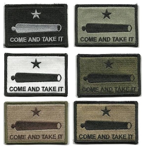 May include: Rectangular patches in various colors, each featuring a star, a cannon, and the text "COME AND TAKE IT." The patches are in black, green, white, and tan, with contrasting embroidery.