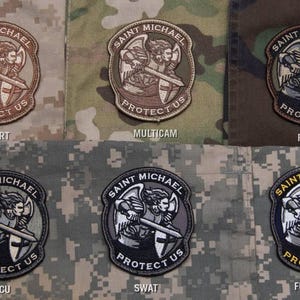 May include: Embroidered patches featuring Saint Michael, with the text "SAINT MICHAEL PROTECT US". Patches are 2.75" x 3.3" and come in Desert, Multicam, Forest, ACU, SWAT, and Full Color variations.