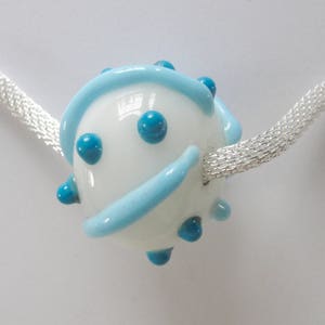 Turquoise blue and white hollow blown bead on silver mesh necklace