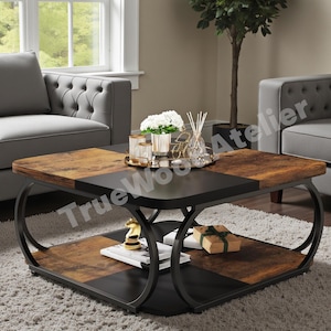 May include: A square coffee table with a two-tone design. The tabletop features a combination of dark brown and black panels. The table has a lower shelf and is supported by curved, black metal legs. Decorative items are displayed on the table.
