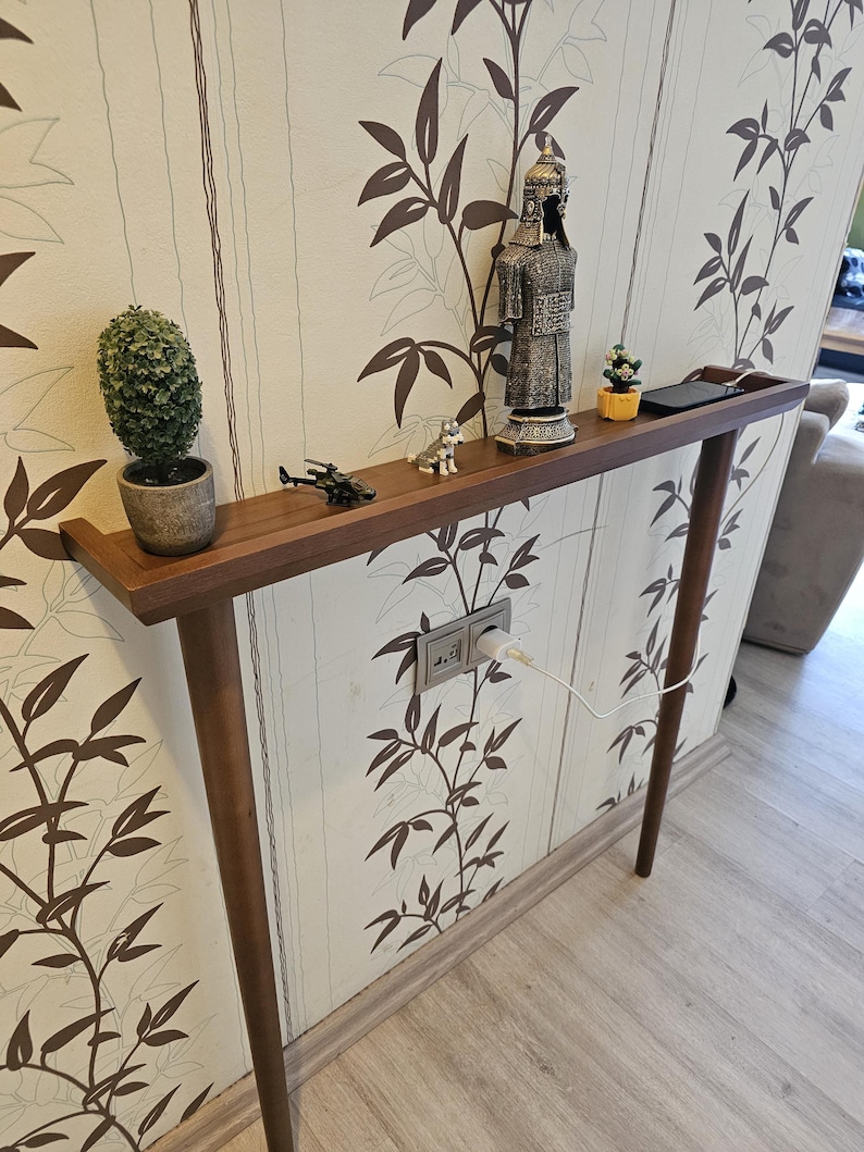 The slim and elegant design makes it ideal for narrow spaces — use it behind a sofa, along a hallway wall, or as an accent under a mirror. It’s a timeless addition to modern or rustic interiors.