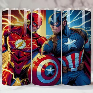 May include: Three stainless steel tumblers with superhero designs. The Flash is shown in red with a yellow lightning bolt, and Captain America in blue with a star shield. The tumblers have a shiny finish and are suitable for cold drinks.