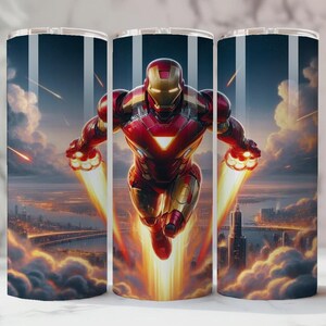 May include: A stainless steel travel mug with a dynamic image of Iron Man soaring through the sky. The design features the superhero in his red and gold suit, with a cityscape and fiery effects. The mug is suitable for both hot and cold drinks.