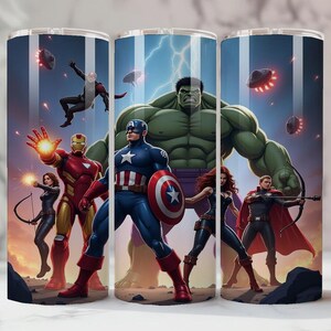 May include: Three stainless steel tumblers with a superhero theme. The design showcases Captain America, Iron Man, and the Hulk, among others, set against a backdrop of a stormy sky with flying objects. The tumblers are cylindrical.
