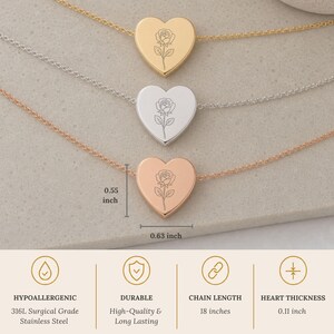 May include: Three heart-shaped pendant necklaces in gold, silver, and rose gold tones, each featuring a delicate rose engraving. The pendants measure 0.55 inches by 0.63 inches. The necklaces are made of 316L surgical grade stainless steel, 18 inches long.